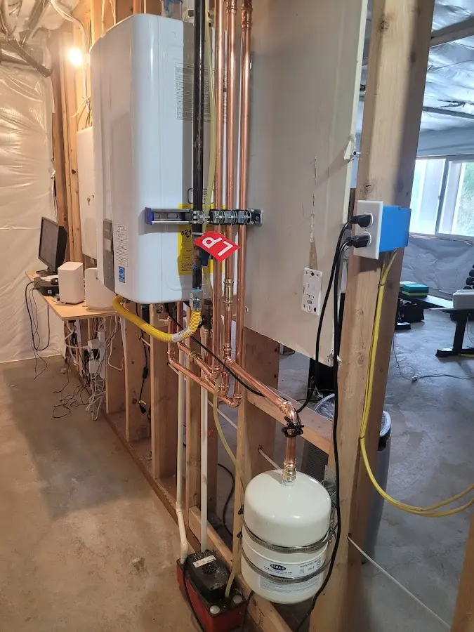 Licensed plumber repairing a kitchen sink in Harrington